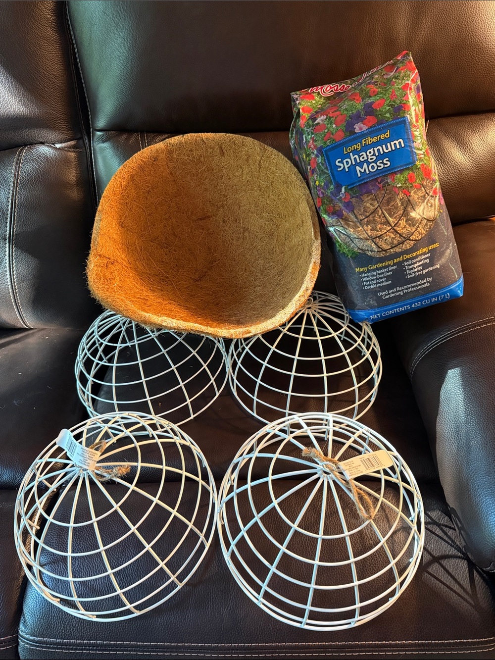 Gardening / art project.   4 half metal spheres moss and coconut liner.  All new